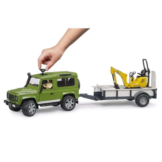Land Rover Defender met aanhanger, JCB minigraafmachine en figuurtje