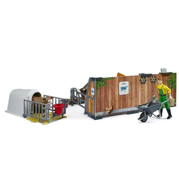 Étable pour vaches et veaux avec agriculteur, vache et veau