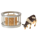 Round feeder with hay bale and cow