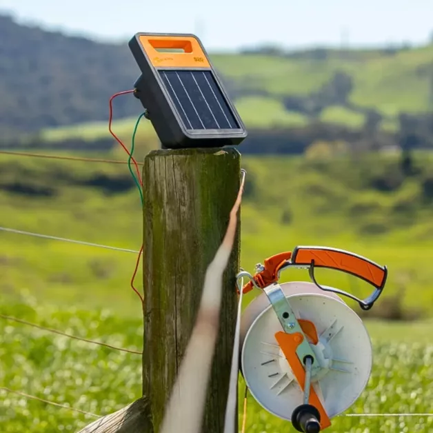 Mounting bracket for electric fence energizer